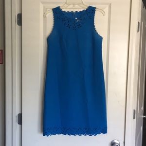 Bright blue summer dress with detailing.